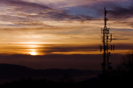communication tower over sunsetの写真素材