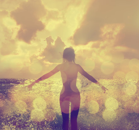 Beautiful Woman in Bikini Standing in the Sea Waves and Enjoying Sunshine with Open Arms