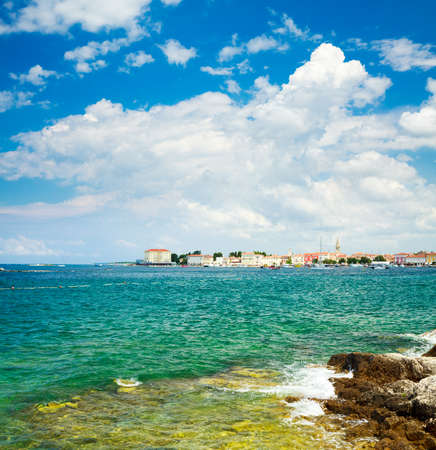 General View of Porec from the Sea. Medieval Mediterranean City in Croatia. Popular Tourist Resort of Istria at Adriatic Sea. Summer Background with Copy Space.の写真素材