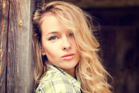 Portrait of a Sensual Fashion Girl on Wooden Background. の写真素材