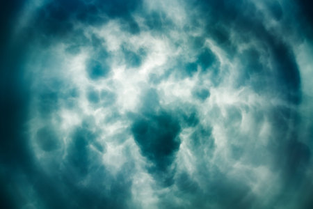 Dramatic Sky Background. Center of Storm Formation. Stormy Clouds in Dark Sky. Eye of Storm Concept. Thundery Clouds. Moody Cloudscape. Toned and Filtered Photo with Copy Space.の写真素材