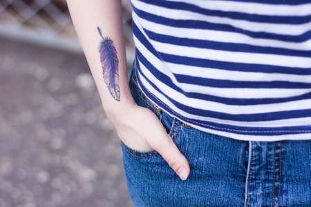 tattoo hand in Pocket girl blue grey hipsterの写真素材