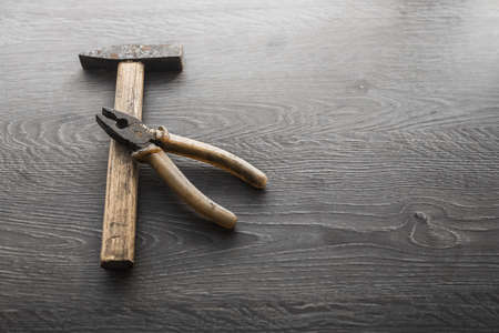 tools on wood panel background hammer vintageの写真素材