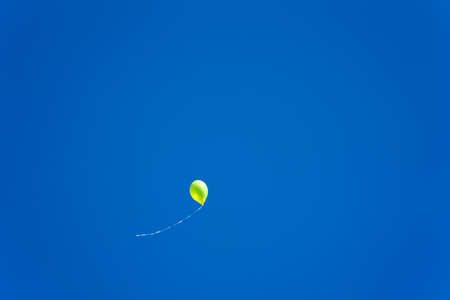 white red blue balloons on a blue sky background white redの写真素材