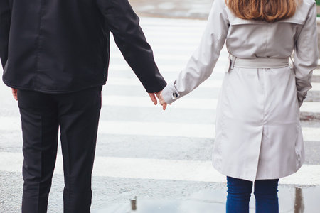 hand at the pedestrian crossing love couple