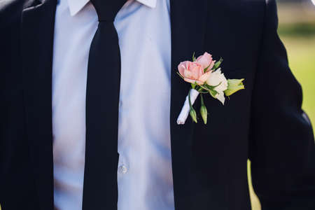 Fashion detail image of a groom wearing a bowtie on his wedding day.の写真素材
