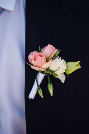Fashion detail image of a groom wearing a bowtie on his wedding day.の写真素材
