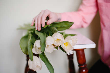 Girl holding tulipsの写真素材