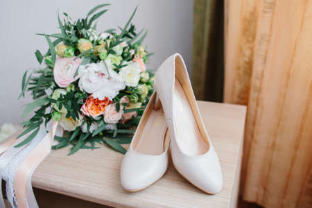 Details of the bride. dress, shoes of bride. morning of weddingの写真素材