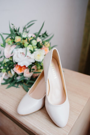 Details of the bride. bouquet, shoes of bride. morning of weddingの写真素材
