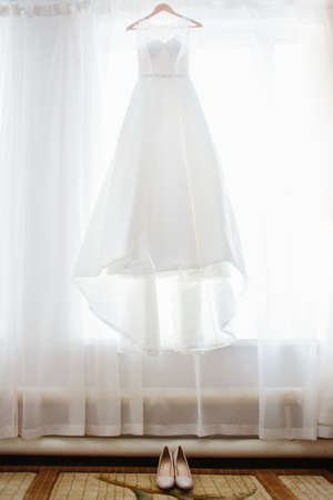 Details of the bride. dress, shoes of bride. morning of weddingの写真素材
