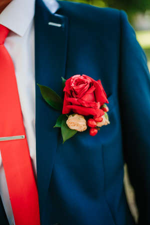 Groom boutonniere on the lapel of his jacket.の写真素材