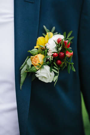 Groom boutonniere on the lapel of his jacket.の写真素材