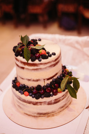 Sweet wedding cake made from fresh berry cupcake