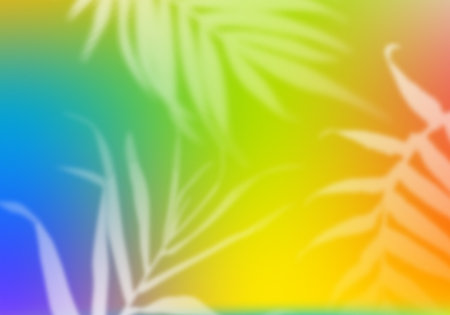 Bright Multicolored Gradient Background with Palm Leaves. Abstract Bg with Blurred Tropical Elements Overlayの写真素材