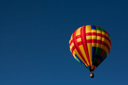 Hot Air Balloon Soars in Perfectly Blue Sky