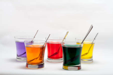 Red, Purple, Blue, Orange, Yellow and Green Easter Egg Dyeの写真素材