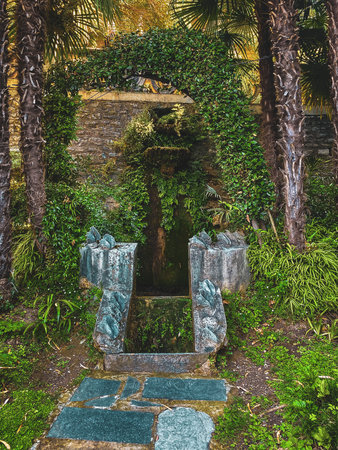 Lake Como, Italy, old stone fountain in the parkの写真素材