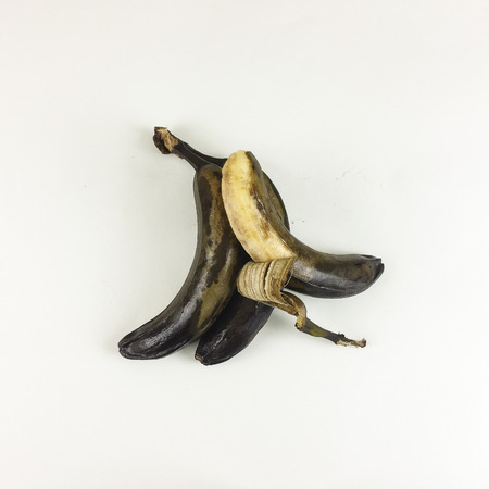 Black and yellow rotten banana isolated on white background - top viewの写真素材