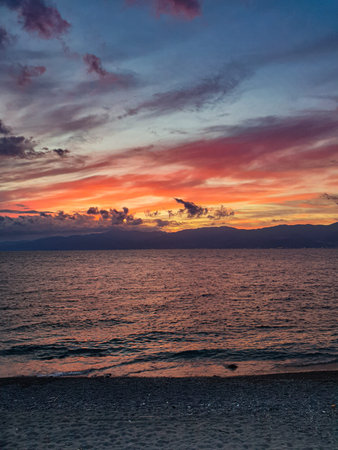 cloudy sky and red sunset on the sea