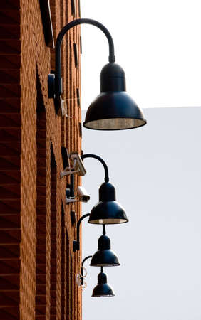 lamps and sequrity camera at the wall of new buildingの写真素材