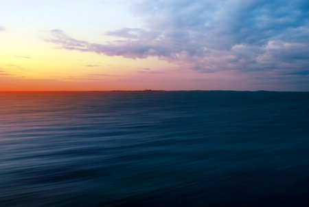 Few Minutes Before Sunset - Ocean in Motion Showing the Speed of Cruise Shipの写真素材