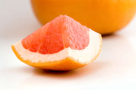 Piece of fresh red grapefruitの写真素材