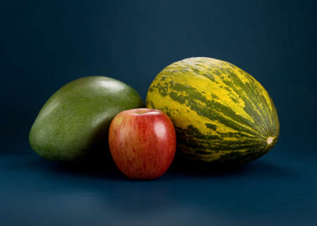 Selection of tropical fruits - mango, melon, appleの写真素材