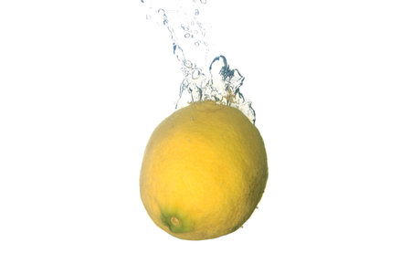a lemon splashing in waterの写真素材
