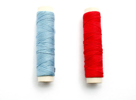 two spools of thread isolatedの写真素材