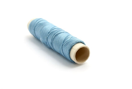 a spool of thread isolated on white backgroundの写真素材