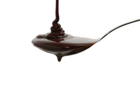 chocolate syrup on a spoonの写真素材