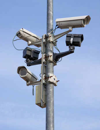 a post full of surveillance cameras