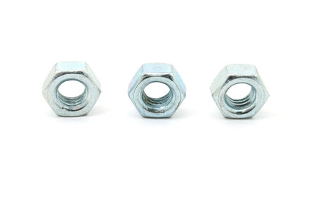 three hex nuts isolated on a white backgroundの写真素材