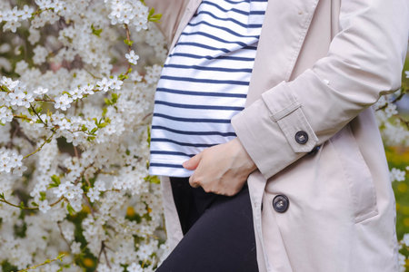 Spring pregnancy, motherhood and family concept.