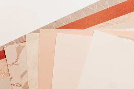 Samples of blinds for windows in the store. Plastic blinds, pleated, roll-up and day-night curtains in store.の写真素材