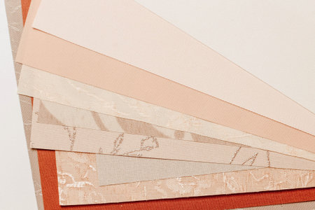 Samples of blinds for windows in the store. Plastic blinds, pleated, roll-up and day-night curtains...