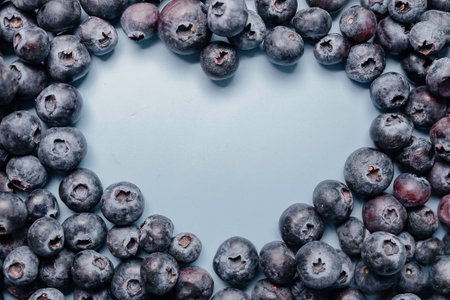Blueberry heart shape symbol concept for healthy eating and lifestyleの写真素材