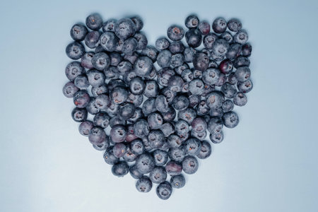 Blueberry heart shape symbol concept for healthy eating and lifestyleの写真素材