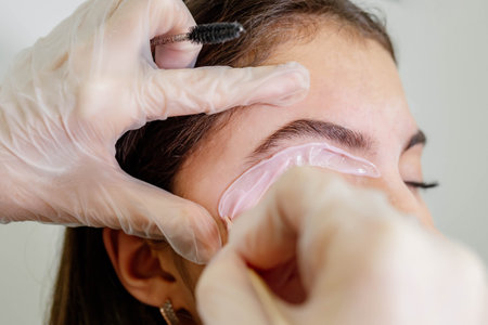 Eyebrow correction with wax in a beauty salon. Eyebrow hair removal with wax.の写真素材