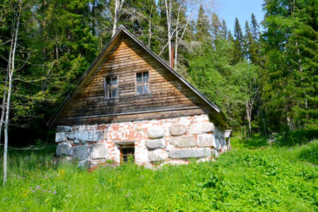 boulder house with wooden roofの写真素材