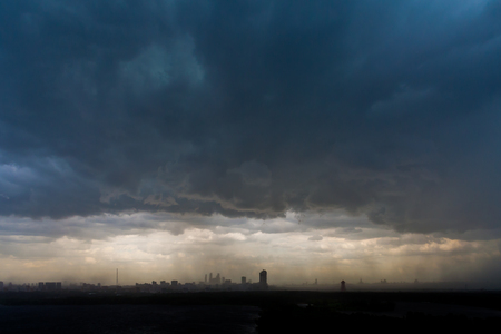 Low leaden storm clouds on a cloudy sky background over the city (Russia, Moscow)の写真素材