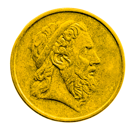 Gold coin with the image of the antique profile isolated on white backgroundの写真素材
