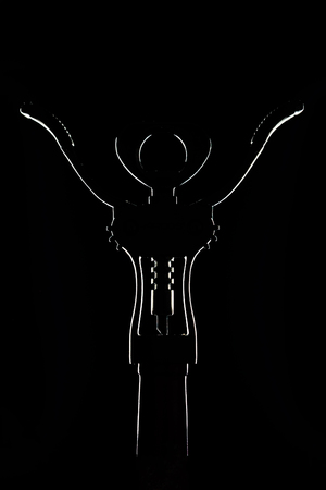 Abstract view of a corkscrew on a wine bottle on a black background with highlighted edgesの写真素材