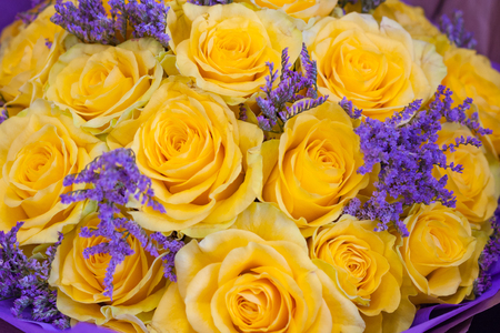 Bouquet of yellow roses and violet lavenderの写真素材