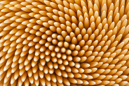 A lot of hygienic dental wooden toothpicks as background, texture (macro)の写真素材