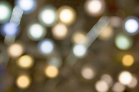 Multi colored lighted lamps in blur as backgroundの写真素材