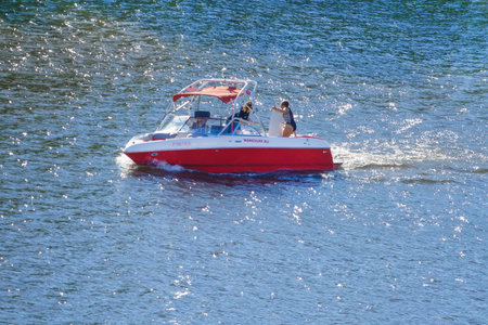 Moscow, Russia, may 2018: Motorboat with vacationers on the blue water (editorial)