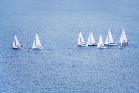 Moscow, Russia, July 2018: A group of small sailing boats on the blue water (editorial)のeditorial素材
