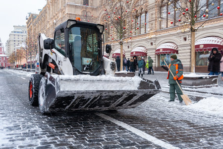 Moscow, Russia, December 2018. Special equipment of municipal services removes snow from street (editorial)のeditorial素材